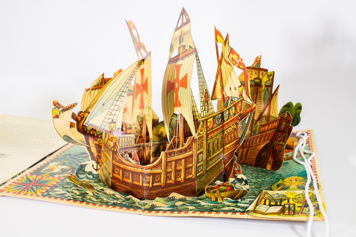 pop up book open to a page with a sailing ship