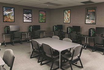 gaming commons area with tables and chairs